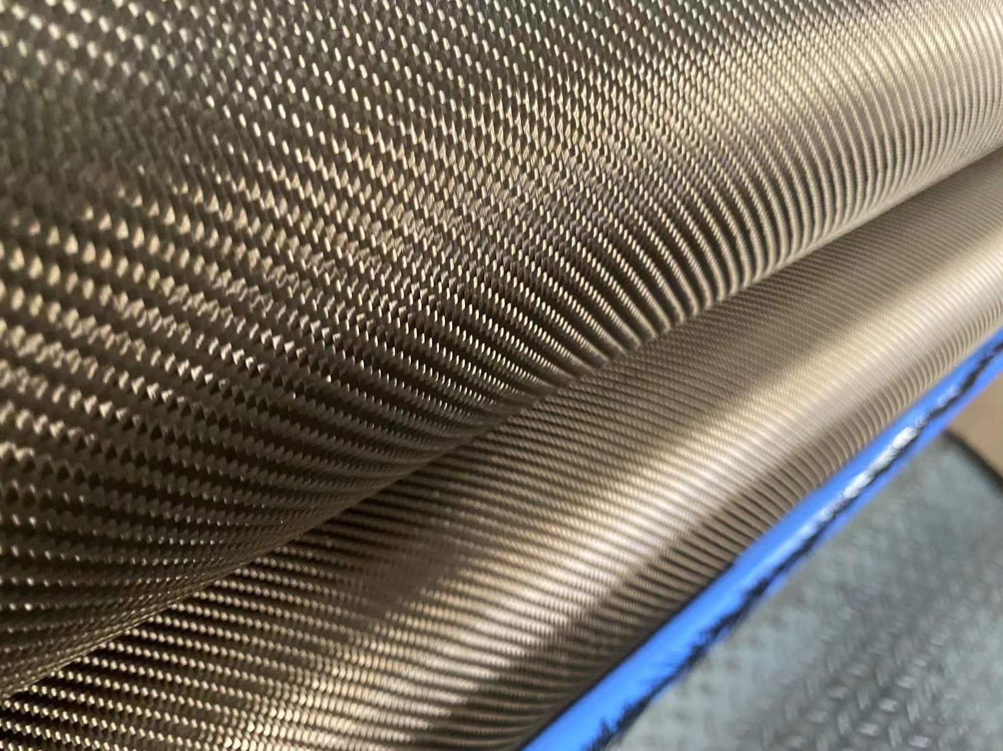 Close-up of basalt fiber composite weave used in advanced yacht hull construction