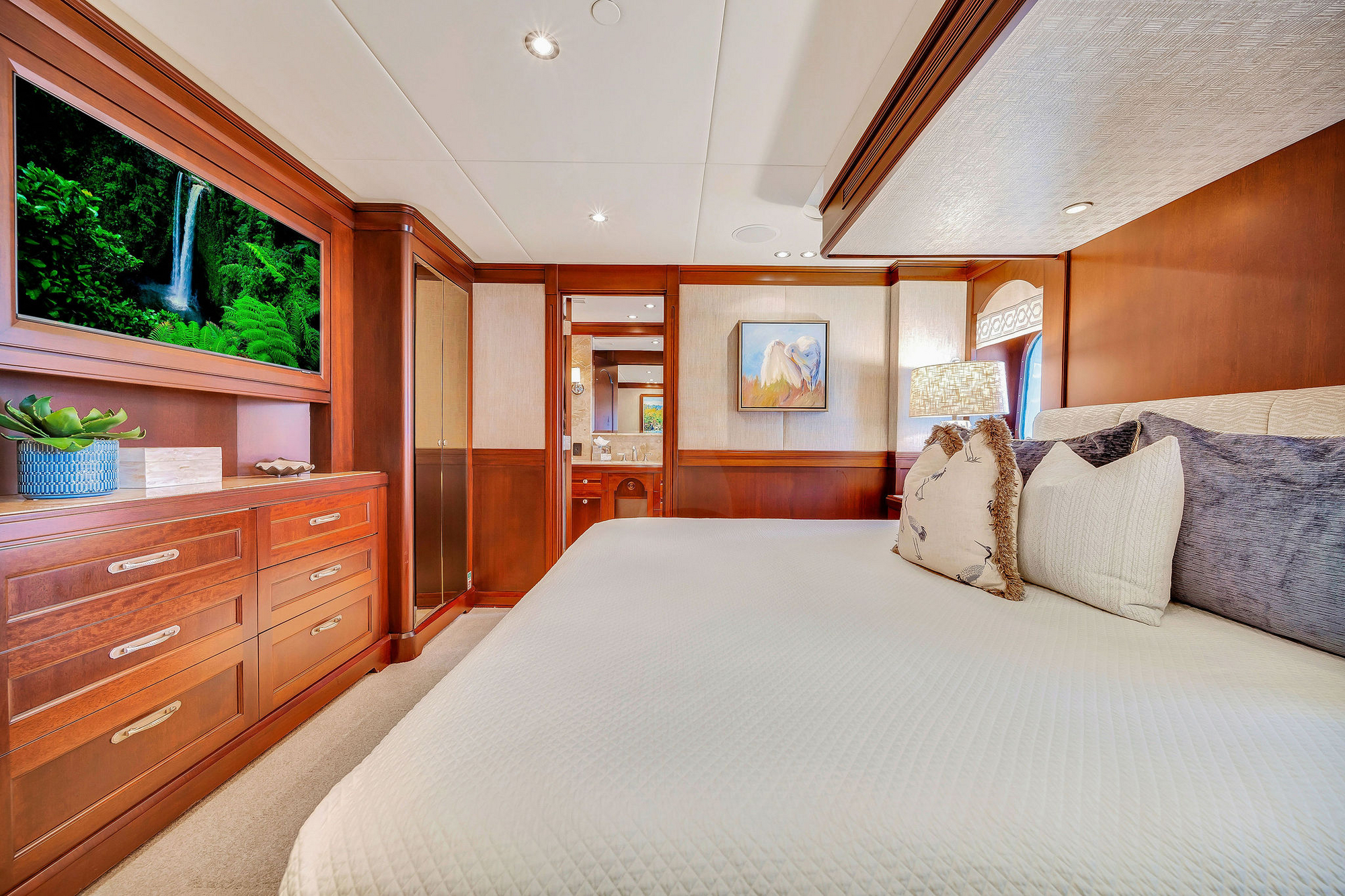Northern Marine master stateroom with luxury bedding and ocean views