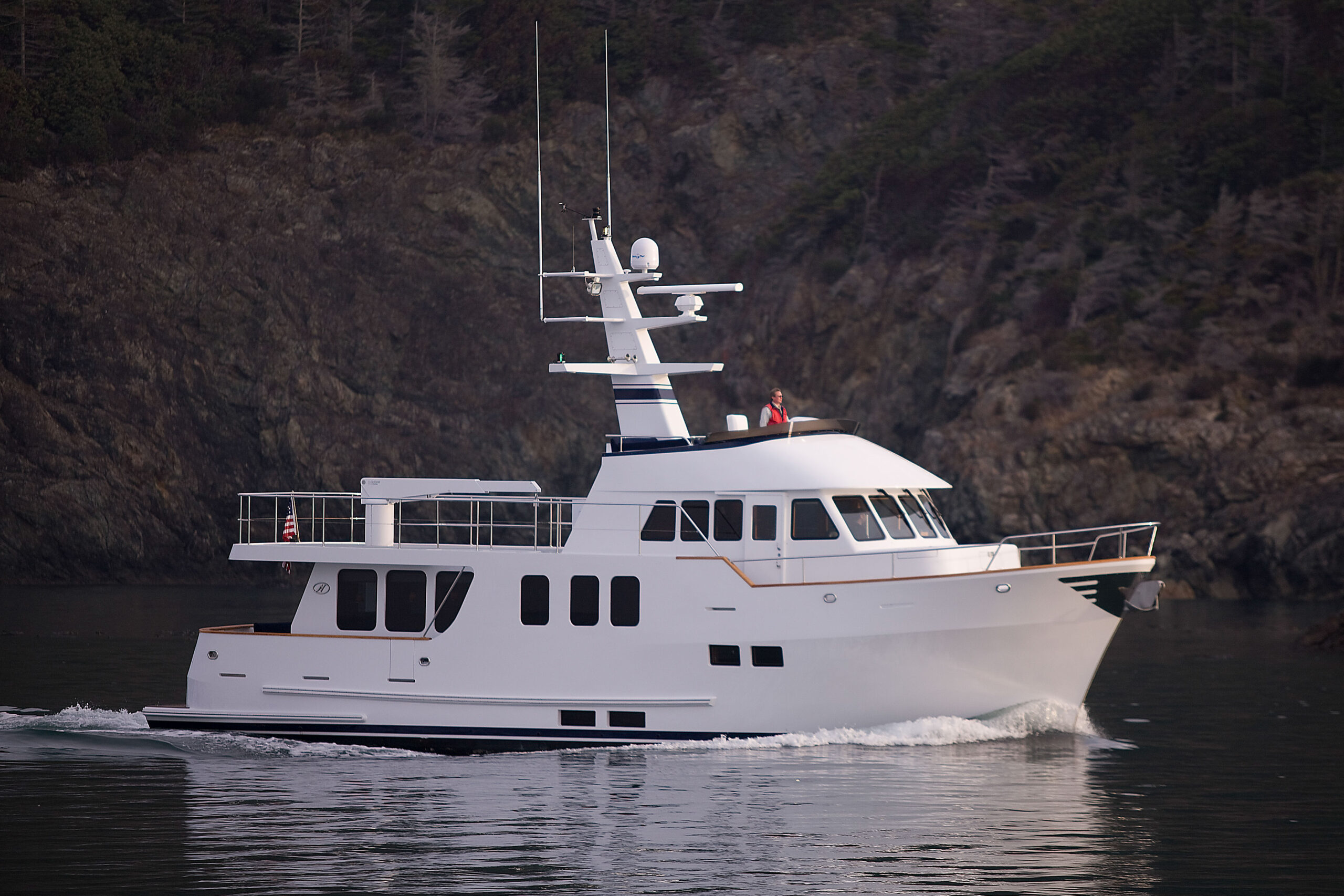 Northern Marine pilothouse with hand-crafted wood paneling and helm instrumentation